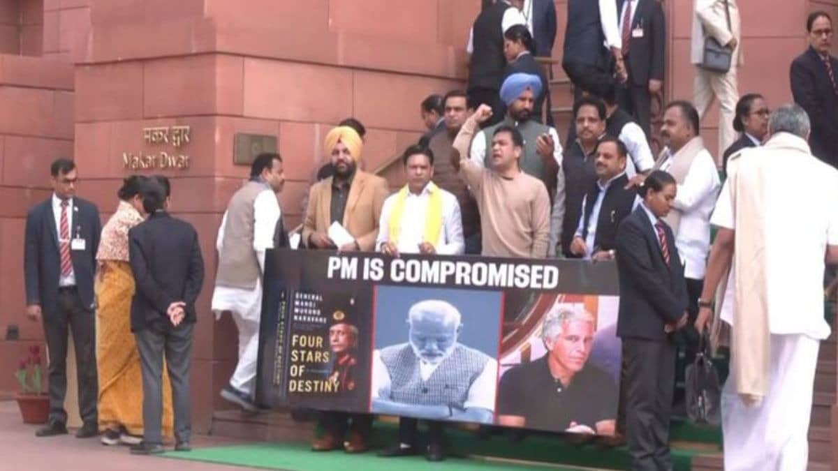 Opposition uproar forces LS adjournment till 12 pm, suspended MPs stage protest outside Parliament